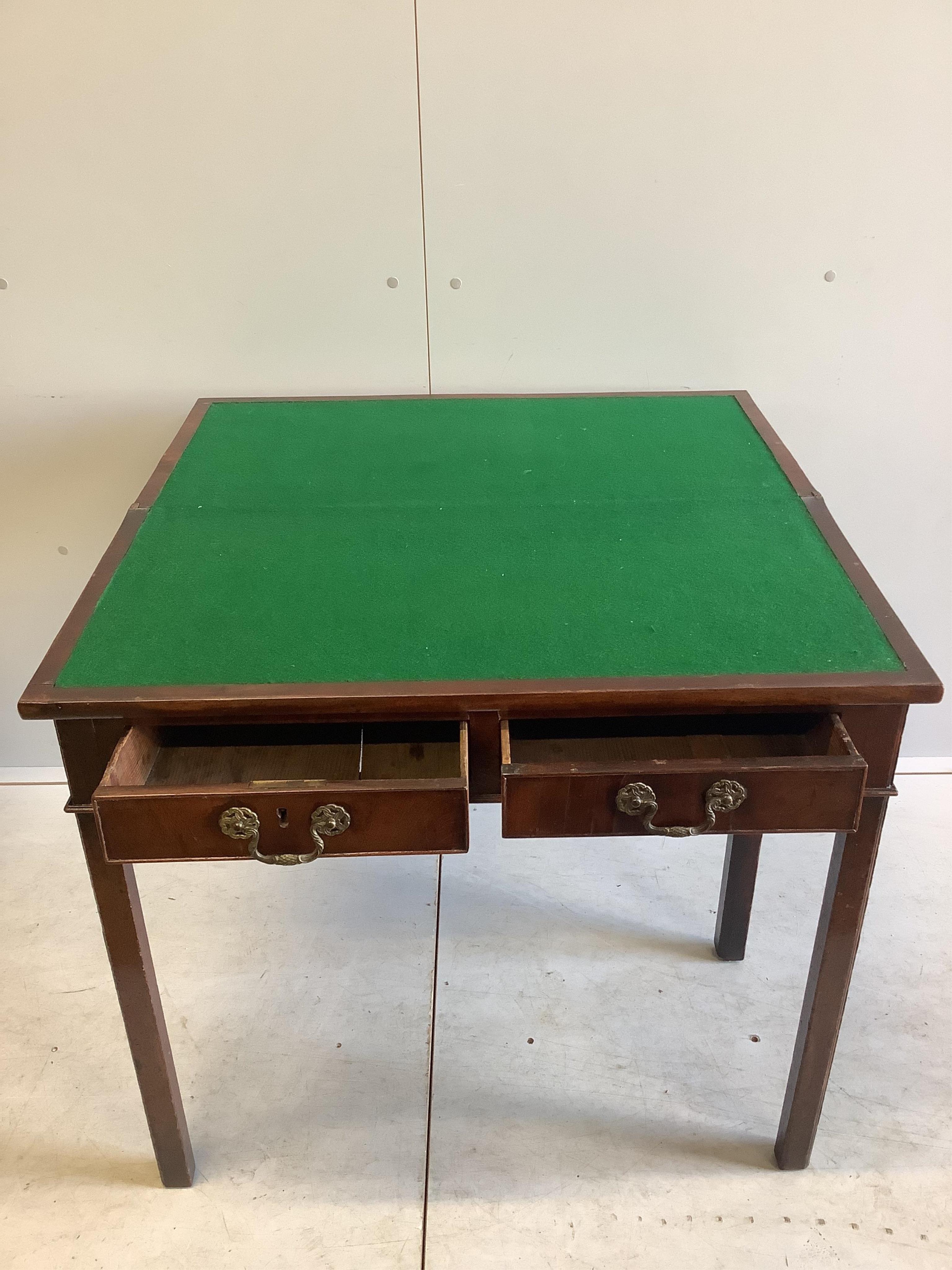 A George III rectangular mahogany folding card table, width 84cm, depth 41cm, height 76cm. Condition - fair